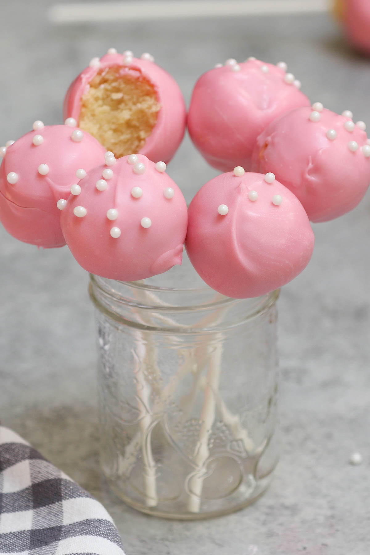 Cake pops are exactly what they sound like – a cross between a cake and a lollipop! These pink treats are perfect for birthday parties. Though made popular by the chain of coffee shops, these Starbucks Cake Pops can easily be recreated at home.