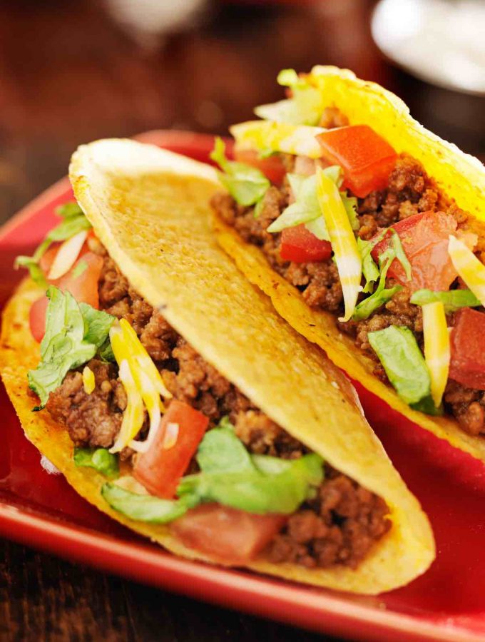 Tacos are one of the most popular Mexican foods. Great Taco Toppings will take your love for tacos to a new level! Great for Cinco De Mayo or Taco Tuesday! We've collected the best taco topping ideas from basic options like guacamole and shredded cheese to chicken, fish, and pork, including ones that are gluten-free and keto-friendly!