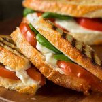 This classic veggie panini is made with ciabatta bread, mozzarella cheese, tomato and basil leaves. It’s loaded with fresh flavors and is one of my favorite panini recipes.
