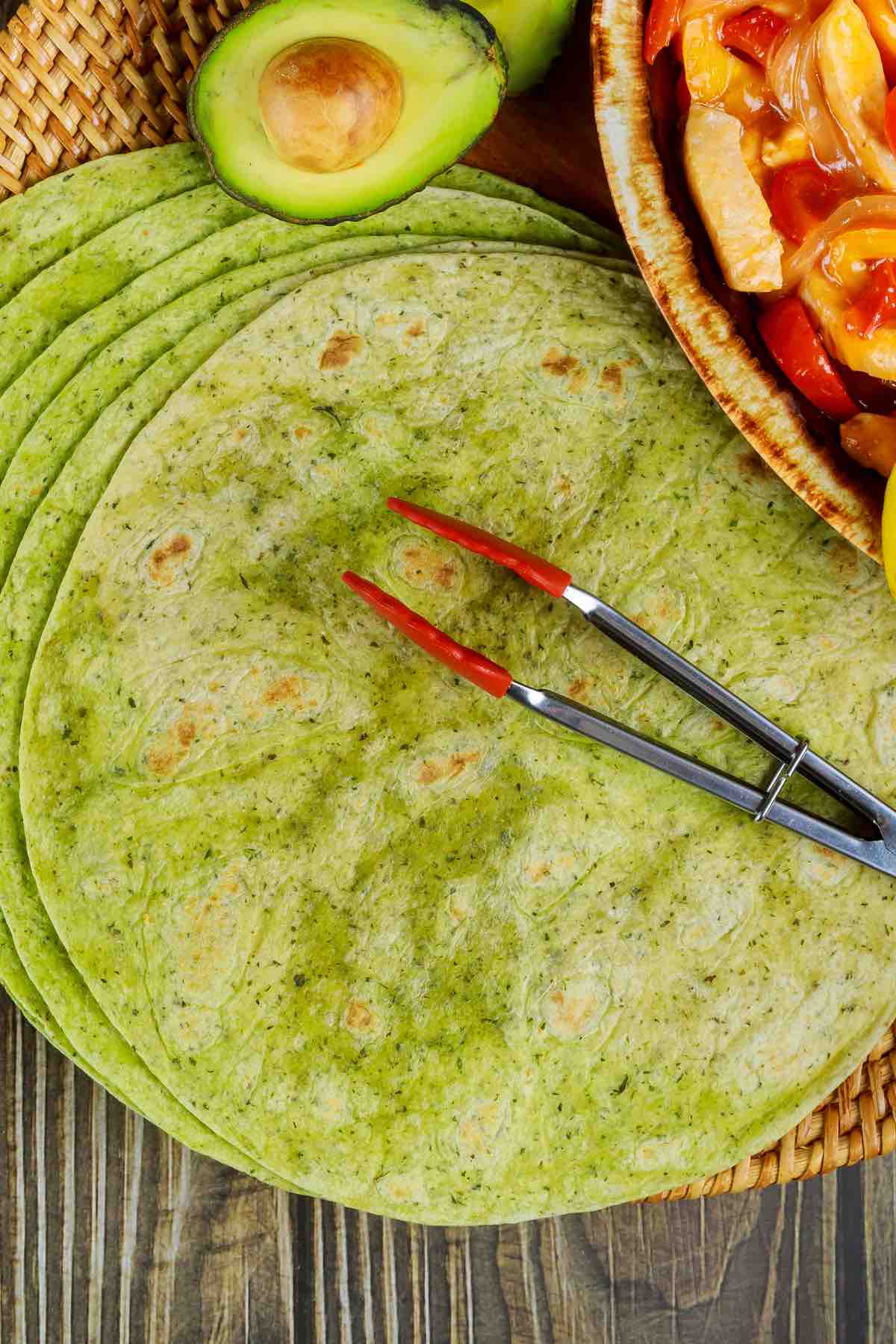 Healthy Spinach Wraps are super easy to make, and perfect for enchiladas, tacos, burritos, and quesadillas. These homemade spinach tortillas are better than the store-bought garden spinach tortilla wraps.