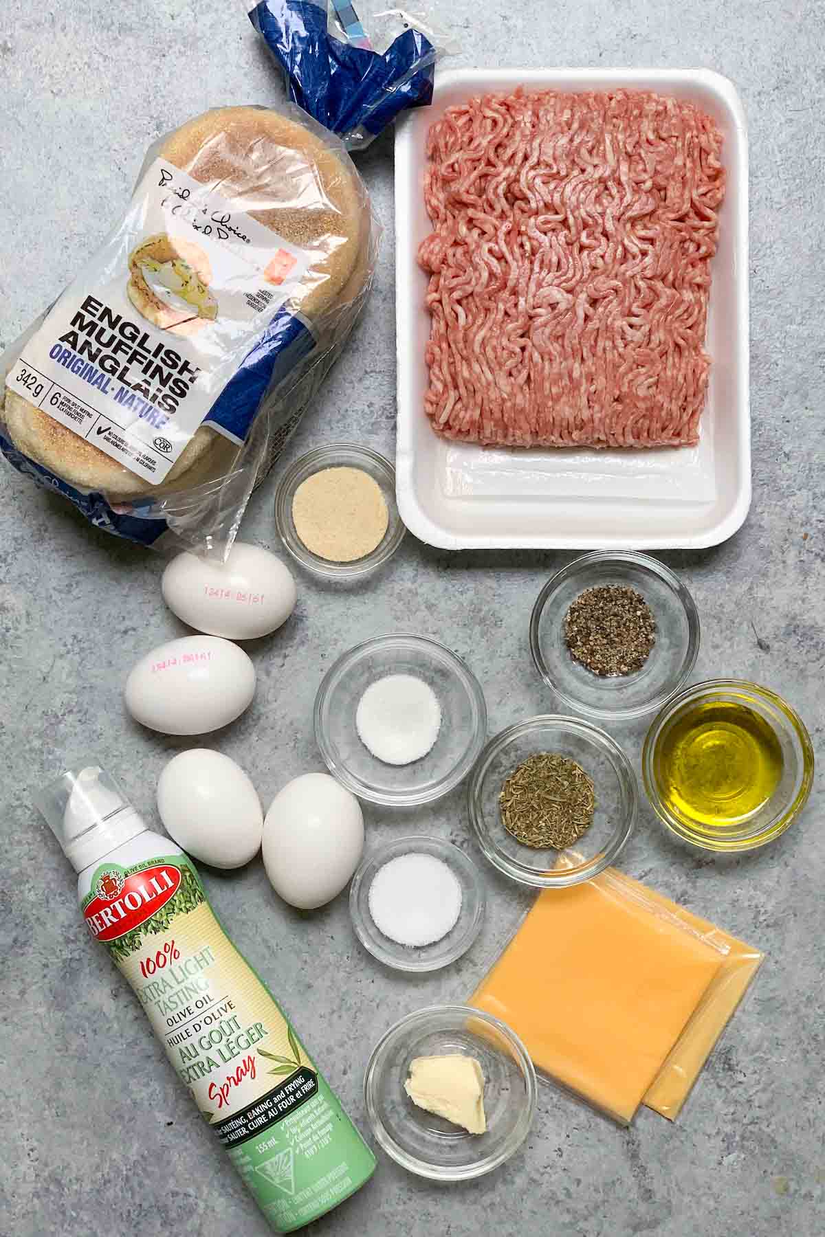 Sausage Egg McMuffins ingredients on the counter.