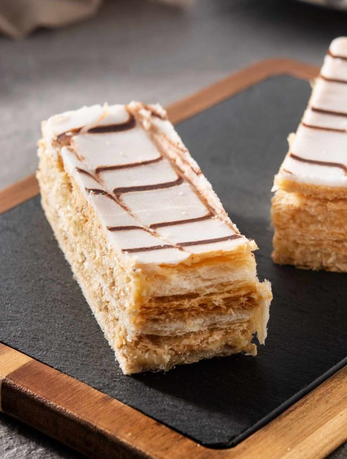 Napoleon Dessert is a classic blend of flaky pastry and creamy filling with a rich yet light taste and texture. Similar to Mile Feuille, it can be paired with tea or coffee for a great afternoon treat or an after-dinner dessert.