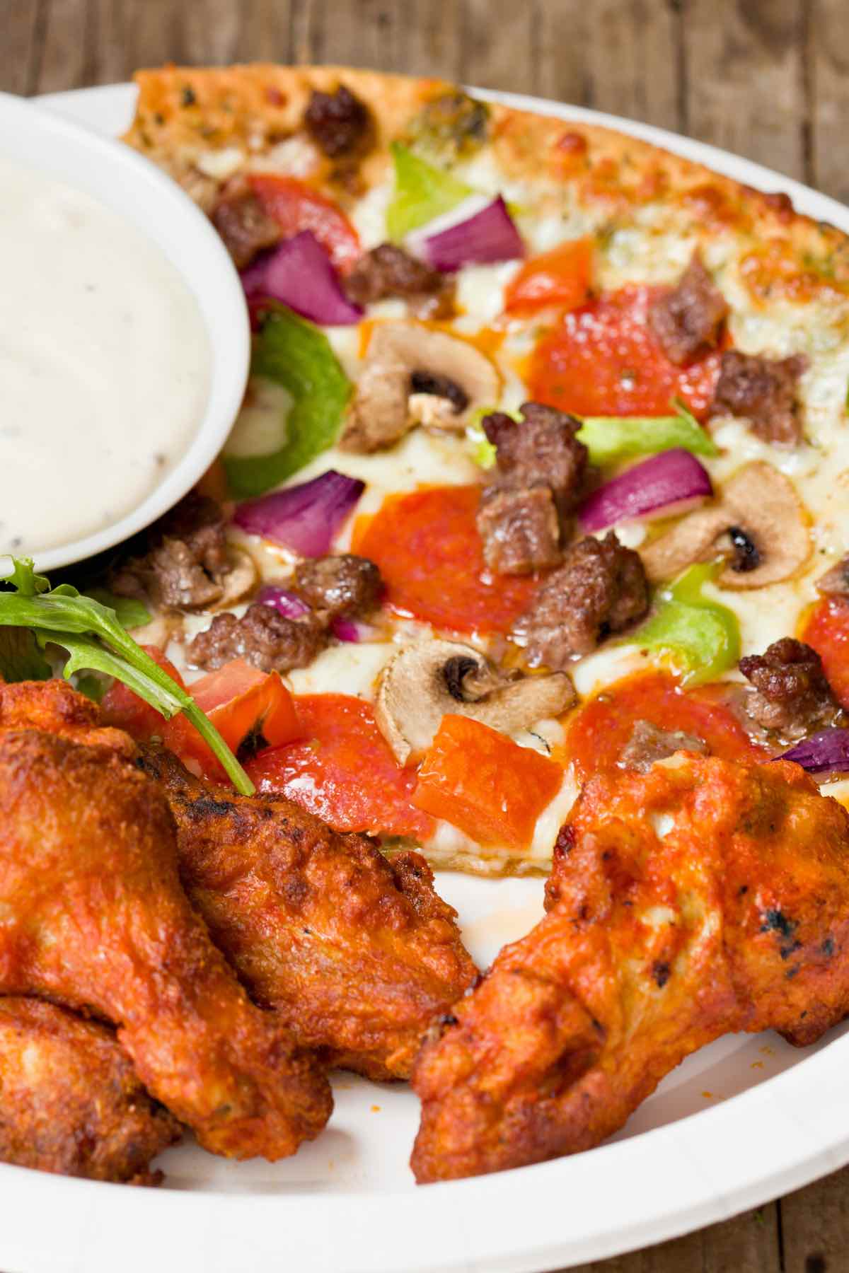 If you're struggling with what to serve with your pizza, you've come to the right place. From healthy vegetables to delicious chicken wings, below you will find 21 of the Best Pizza Sides that will complement your pizza and fill up your guests! 