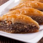 Baklava has flaky phyllo pastry on the outside and sweet, crunchy walnuts on the inside. It’s one of our favorite Greek desserts.