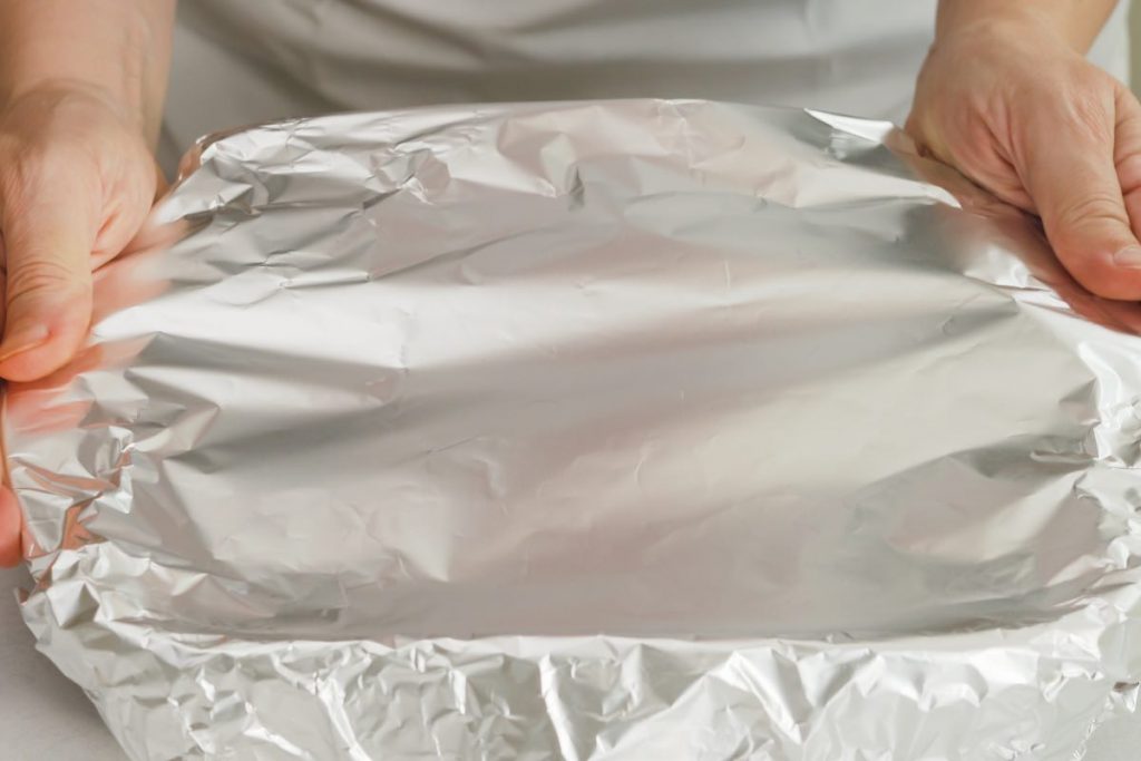Covering the dish with foil