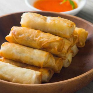 These super crispy Chinese spring rolls are incredibly easy to make. Serve with a honey garlic dipping sauce for a crowd-pleasing dim sum.