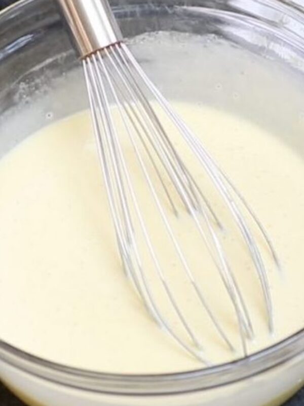 Heavy cream in a large clear bow on the table