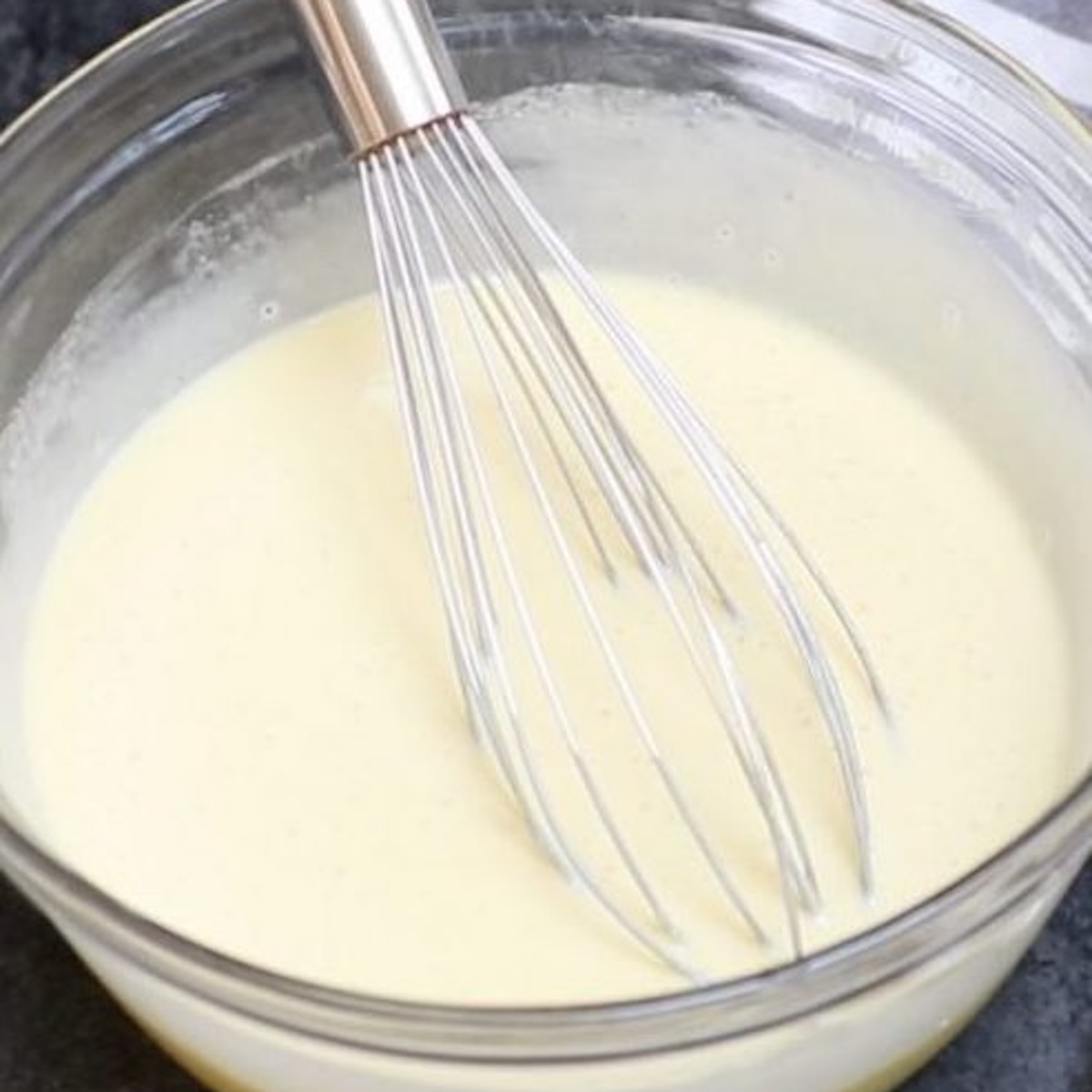 Heavy cream in a large clear bow on the table