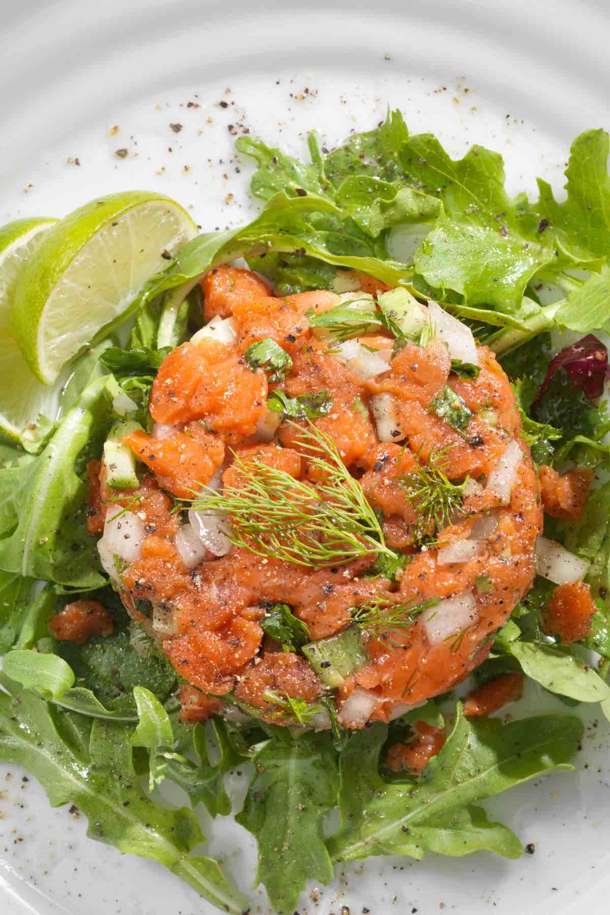 You’ll hardly find a more elegant appetizer than Salmon Tartare. Despite its fancy name, this dish is deceptively easy to prepare with just a few simple ingredients. Using sashimi-grade salmon and classic seasonings, you’ll have a sophisticated platter that’s sure to impress.
