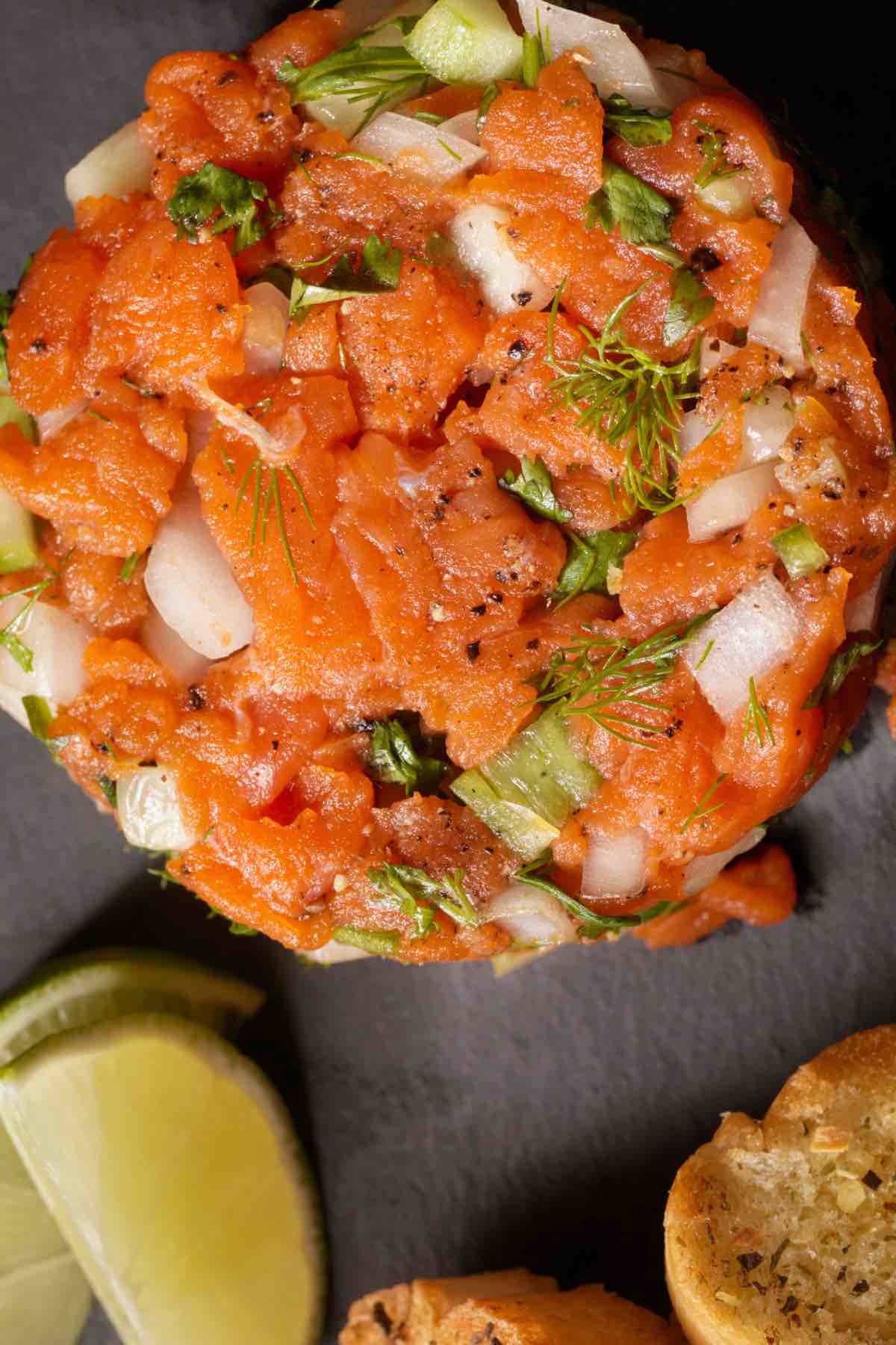 You’ll hardly find a more elegant appetizer than Salmon Tartare. Despite its fancy name, this dish is deceptively easy to prepare with just a few simple ingredients. Using sashimi-grade salmon and classic seasonings, you’ll have a sophisticated platter that’s sure to impress.
