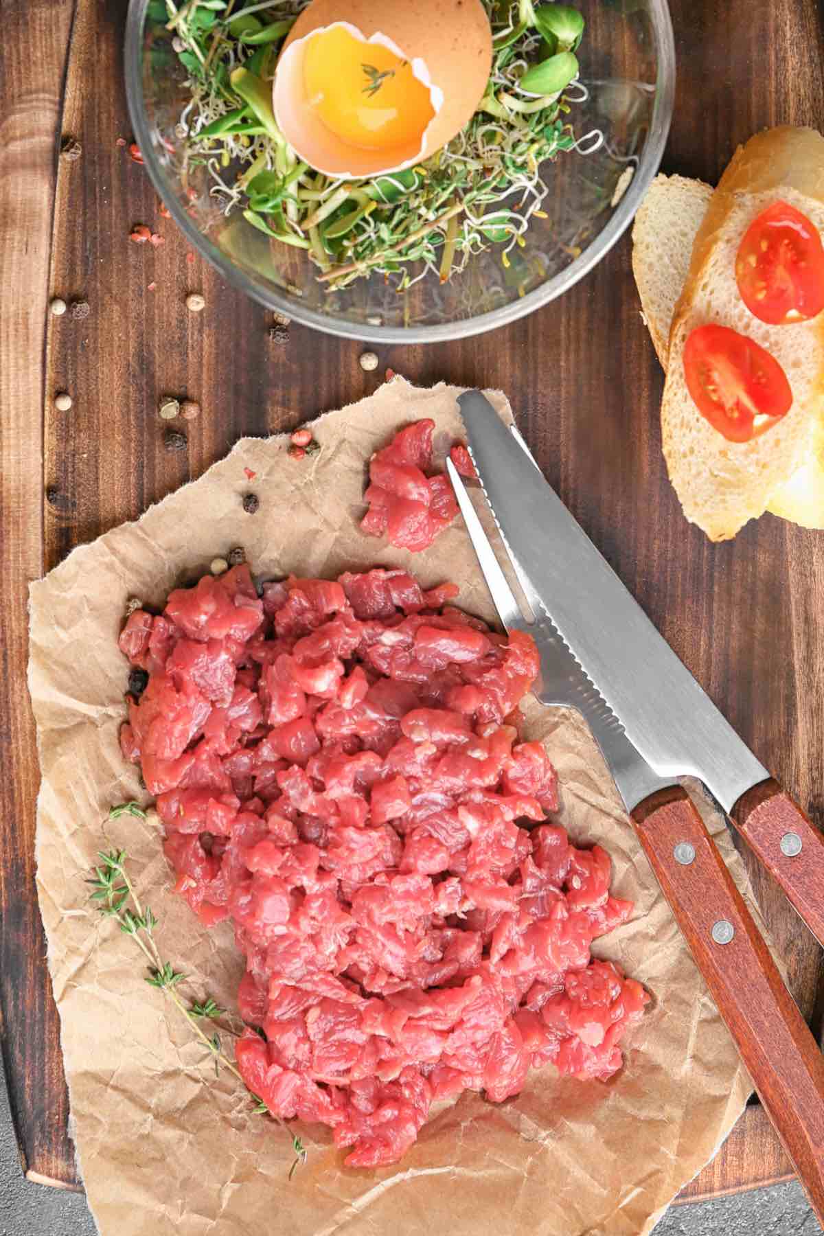 Steak Tartare ingredients on a cutting board