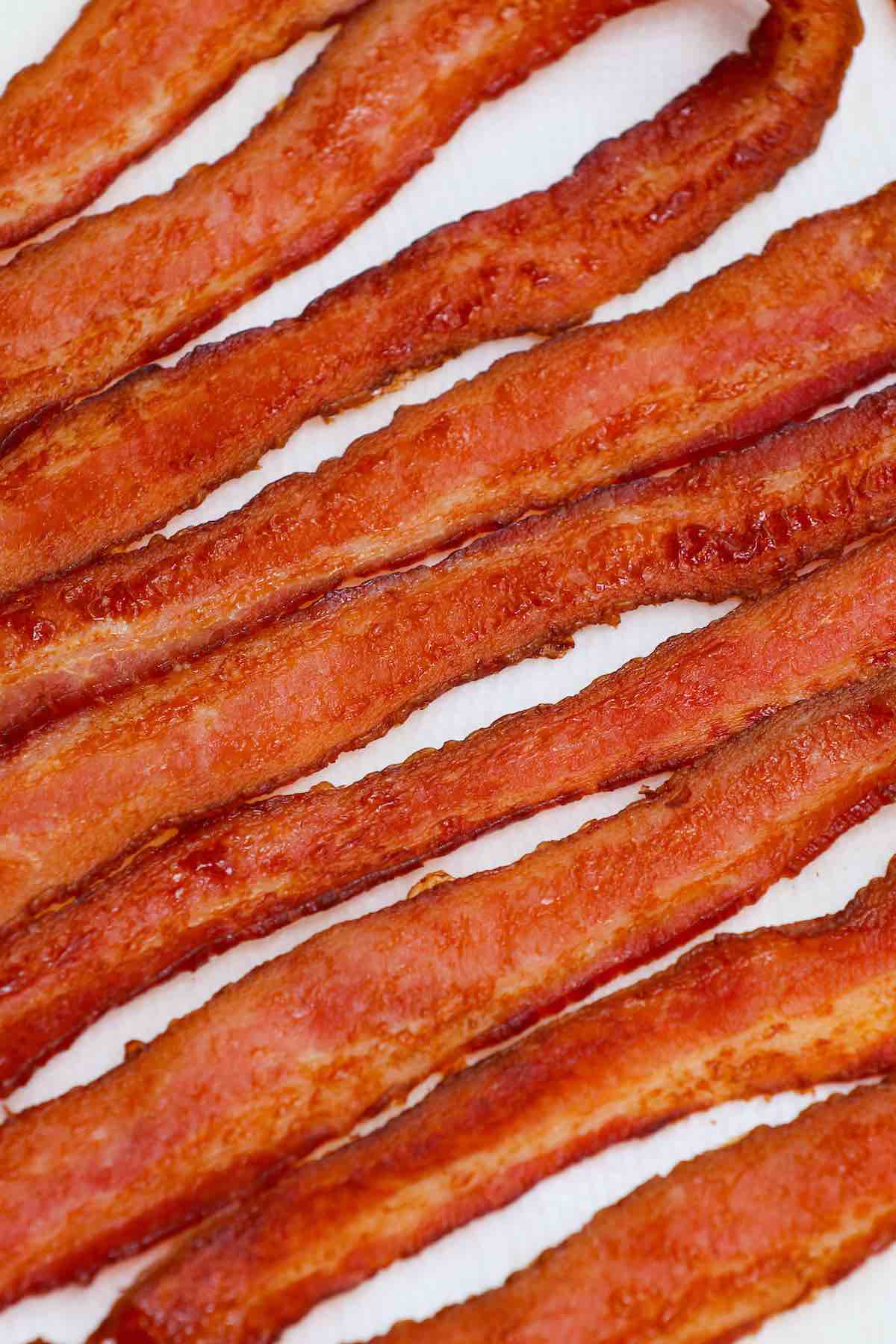 When bacon isn’t stored in proper conditions, or if it’s been stored for too long, it can become spoiled, just like any other meat. Consuming spoiled food is a health risk, so it’s important to learn how to tell if bacon is bad.