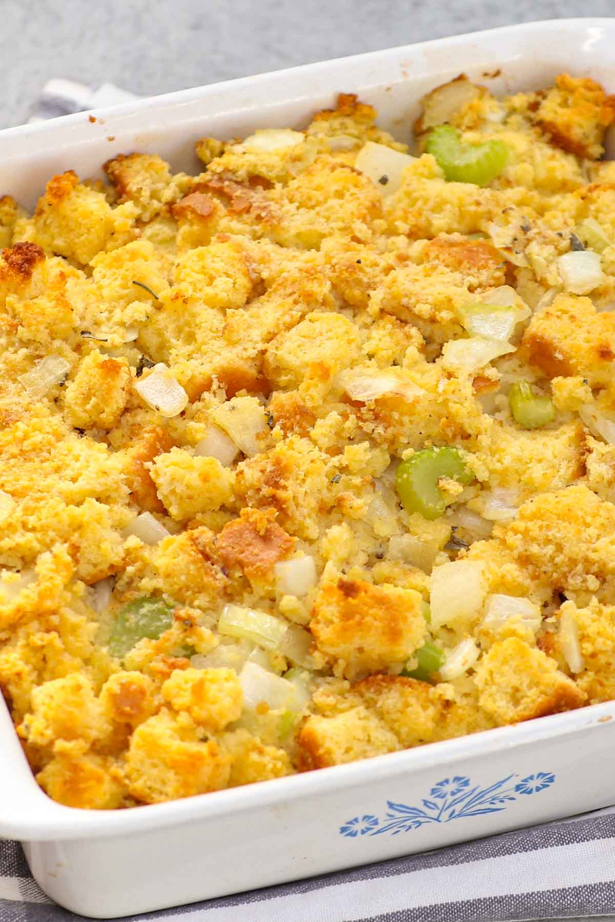 If you’re looking for a comforting, old-fashioned Southern dish, look no further than Cornbread Dressing. This Paula Deen cornbread stuffing is the perfect holiday side dish for your Thanksgiving or Christmas dinner menu. Enjoy it with your favorite proteins and a smothering of cranberry sauce for a supremely festive dish.