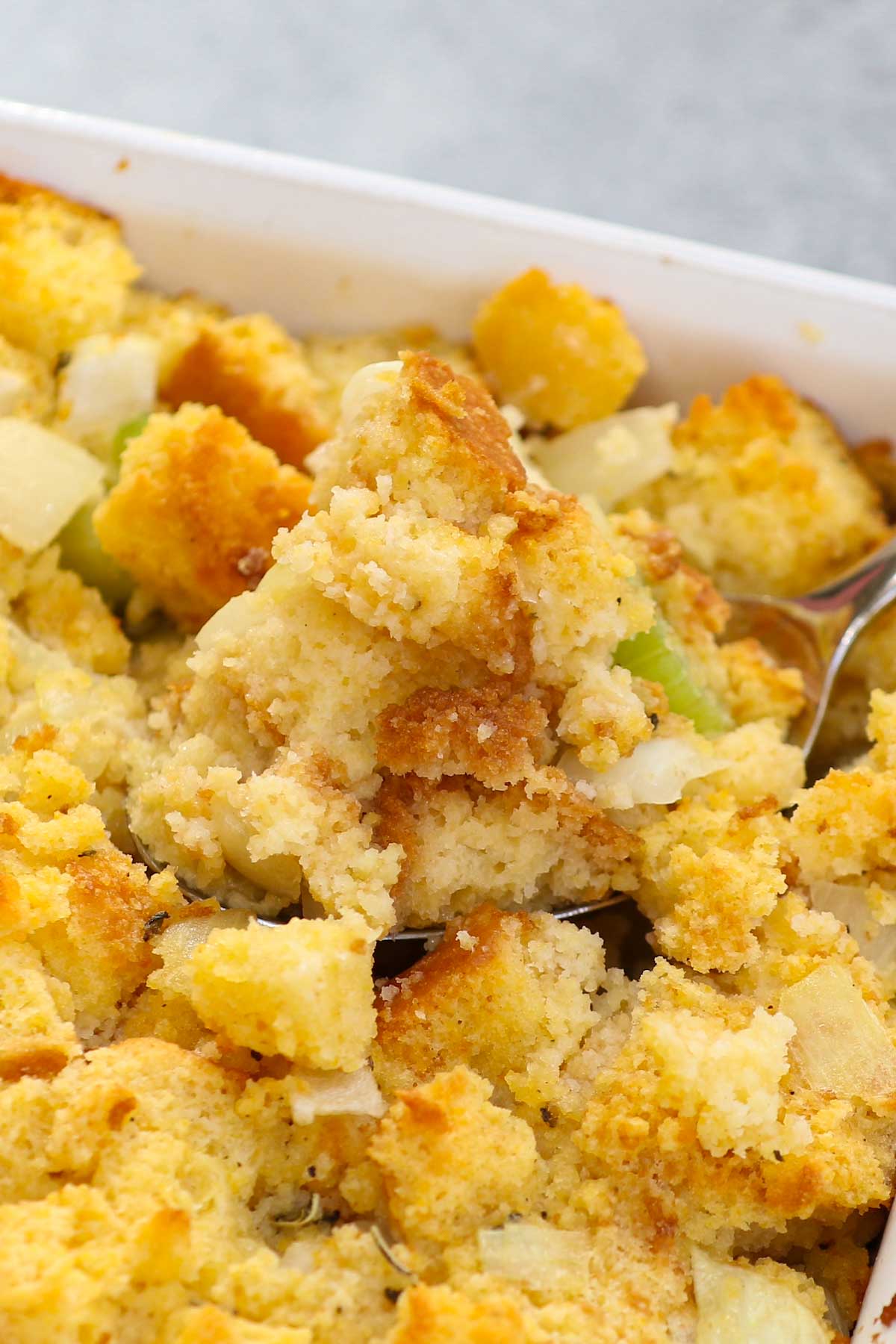If you’re looking for a comforting, old-fashioned Southern dish, look no further than Cornbread Dressing. This Paula Deen cornbread stuffing is the perfect holiday side dish for your Thanksgiving or Christmas dinner menu. Enjoy it with your favorite proteins and a smothering of cranberry sauce for a supremely festive dish.