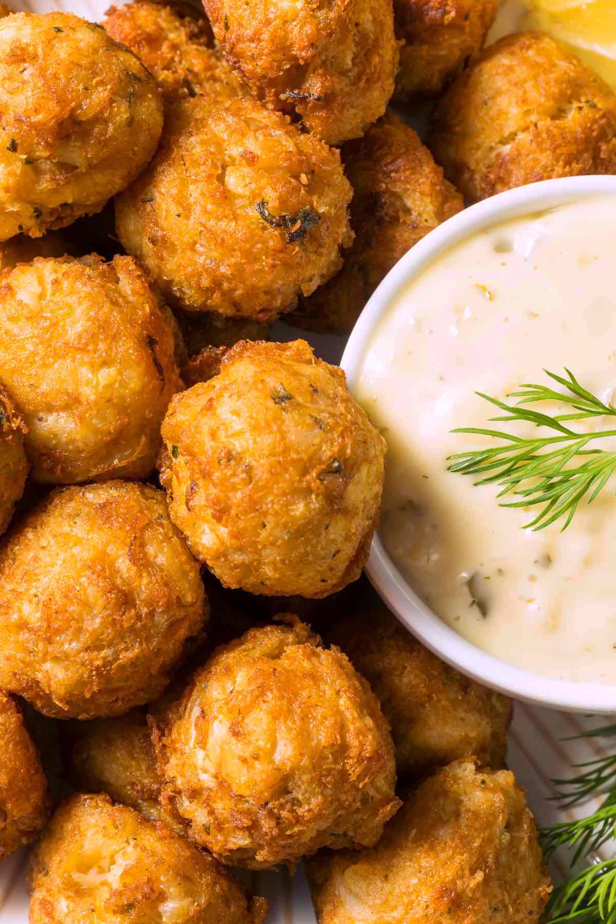 Homemade baked Crab Balls are delicious mini crab cake bites made with high-quality crab meat. This recipe is easy to prepare and makes tasty hors d'oeuvres or can be used as protein in a salad or wrap.