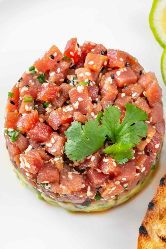 Tuna Tartare is a delectable, yet simple dish, consisting of cubes of raw, sashimi-grade tuna that has been lightly seasoned. The tuna is placed atop creamy avocado for a flavor combo that’s out of this world.