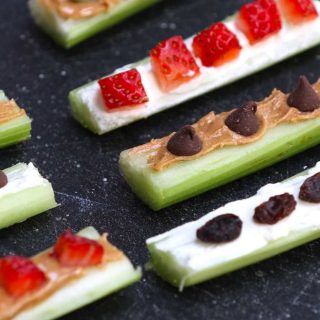 Ants on A Log are nutritious snacks that are loaded with celery, peanut butter, and raisins. They are so fun to make with kids and you can customize them easily with your favorite nuts and fruits.