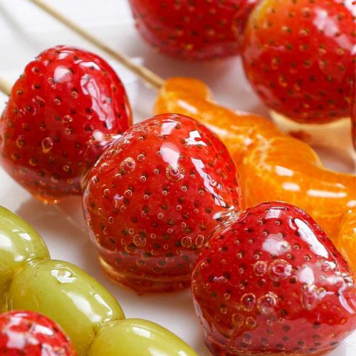 Also called Tanghulu, these Candied Fruits are as pretty as they are delicious. Juicy strawberries, grapes or tangerine wedges are coated in a hardened sugar syrup that forms a sweet crunchy shell around the fruit.