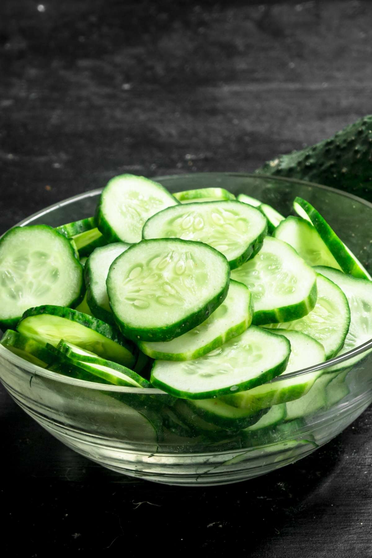 If you have a lot of cucumbers on hand, either from your home garden or from a sale at your grocer, you may wonder if it’s possible to freeze cucumbers. While freezing cucumbers will affect the texture, largely because they contain a lot of water, you can freeze cucumbers and then use them in ways you may not have thought of before.