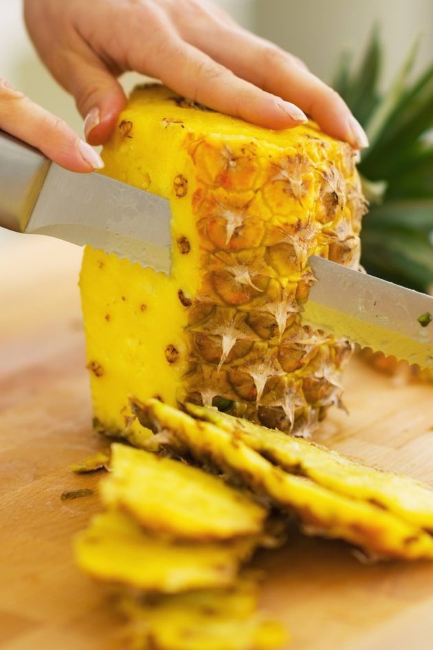 Cutting-Pineapple-630x945