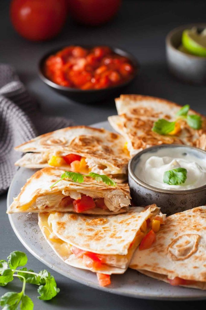 If your family loves Mexican food, quesadillas are probably on high rotation in your household. Good Quesadilla Side Dishes will take your experience to a new level! Today we’re sharing some ideas on what to serve with quesadillas. Some of the options are classics, while others may surprise you!