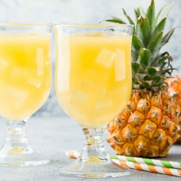Pineapple Crush cocktails are refreshing, delicious, and super easy to make! Simply mix together pineapple juice, vodka, triple sec, and sparkling water. Great for happy hours, game day gatherings or your next cocktail party.