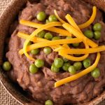 Refried beans are a versatile ingredient that can be enjoyed in many dishes. From nachos to enchiladas and even pizza, this Mexican staple adds delicious flavor and a good source of protein to dishes.