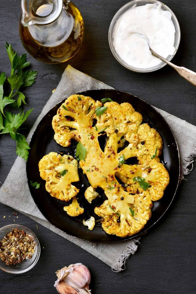 If you’re living the keto lifestyle and following a low-carb diet, cauliflower will soon become your best friend! This versatile veggie serves as a delicious substitute for potatoes, rice, and even pasta. We’ve rounded up over 20 best Keto Cauliflower Recipes for you to get started, whether you serve them as a side dish or main course, they are so comforting and delicious when paired with cheese, heavy cream, butter or cream cheese.
