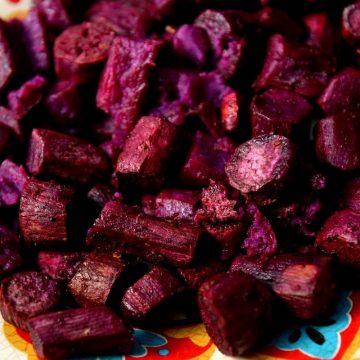 Purple potatoes taste just like their white cousins but are packed with antioxidants and won’t cause your blood sugar to spike as much. If you haven’t tried purple potatoes, now’s your chance! We’ve collected the 12 of the best purpose potato recipes for you to try. From roasted to mashed, and even in a salad, purple potatoes are a colorful change of pace.