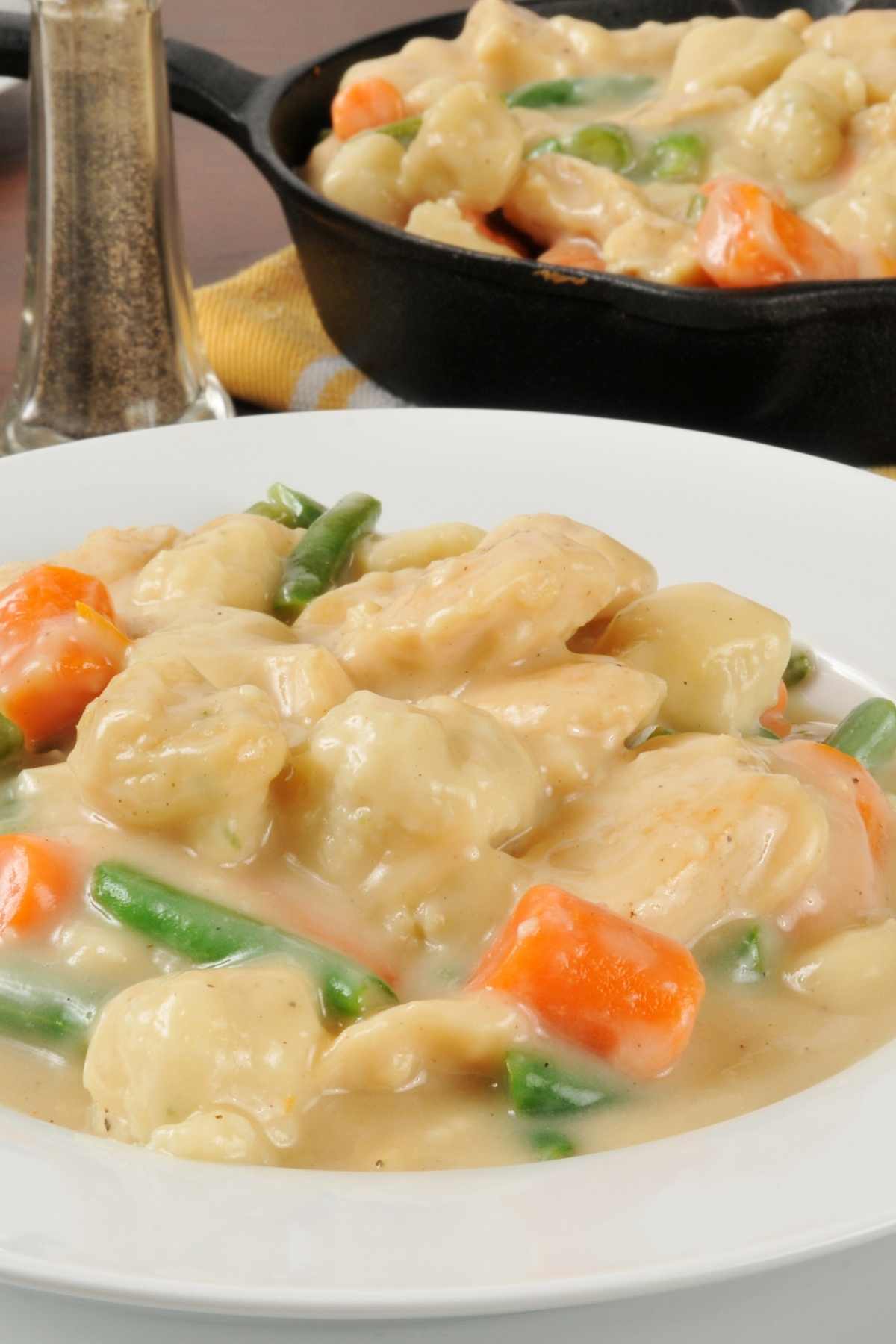 Creamy, rich, and hearty is the best way to describe this recipe for chicken and dumplings with biscuits. It’s a stick-to-your-ribs comfort dish that’ll satisfy even the biggest of appetites!