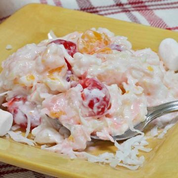 Celebrate summer with this classic marshmallow fruit salad. It’s a colorful combination of marshmallows, shredded coconut, whipped cream, sour cream, mandarin oranges, and fresh cherries, pineapple, and other toppings of your choice.