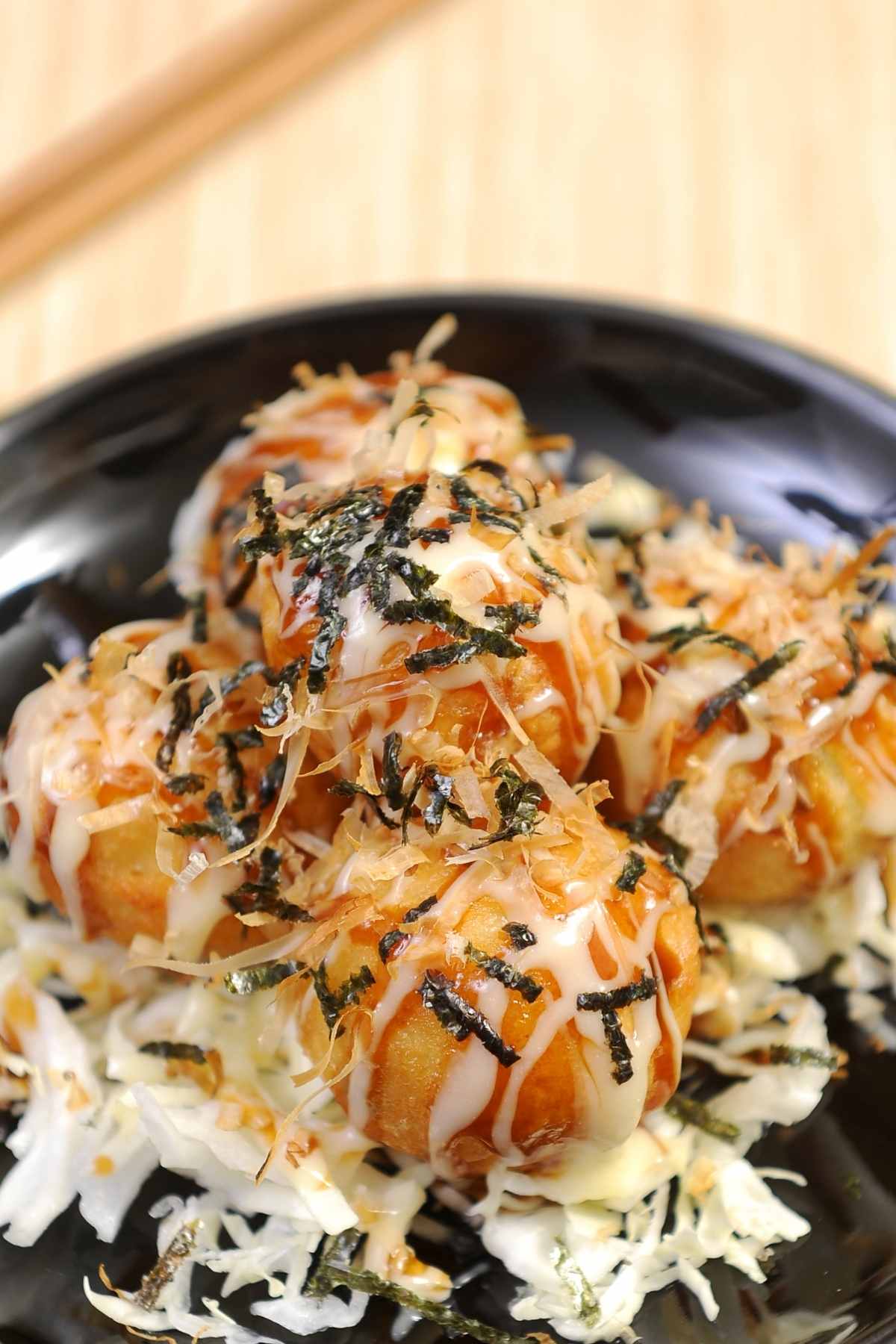Octopus Balls (also known as Takoyaki) are small dumplings with a tender chunk of octopus in the center. It has a crispy outer layer and a tender, juicy filling. This well-known Japanese street food has a unique taste and is fun to prepare!