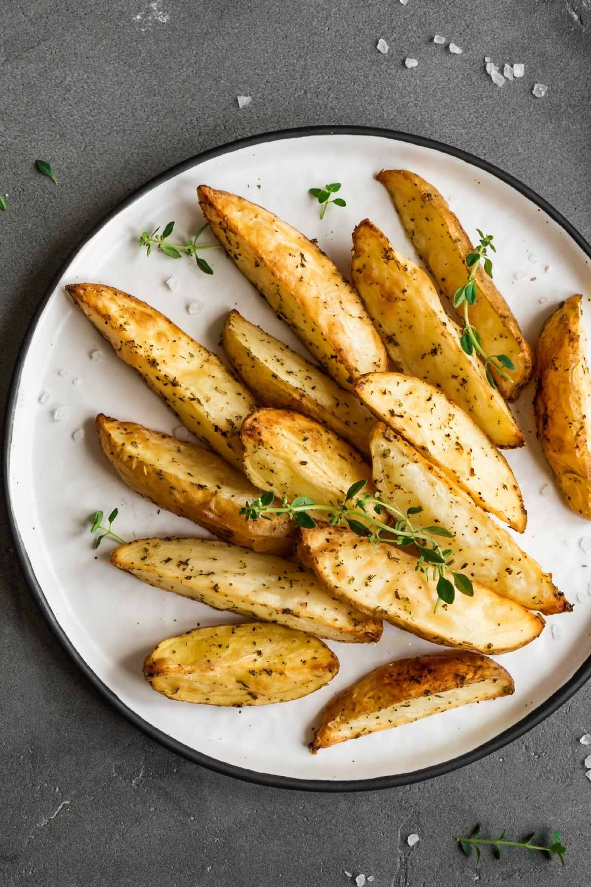 The perfect potato wedges are soft and tender on the inside and crisped to perfection on the outside. Throw in some crunchy garlic and fresh Parmesan and you’ve got the tastiest potato wedges of all time. This recipe is easy to make and results in perfect potato wedges, without parboiling first.