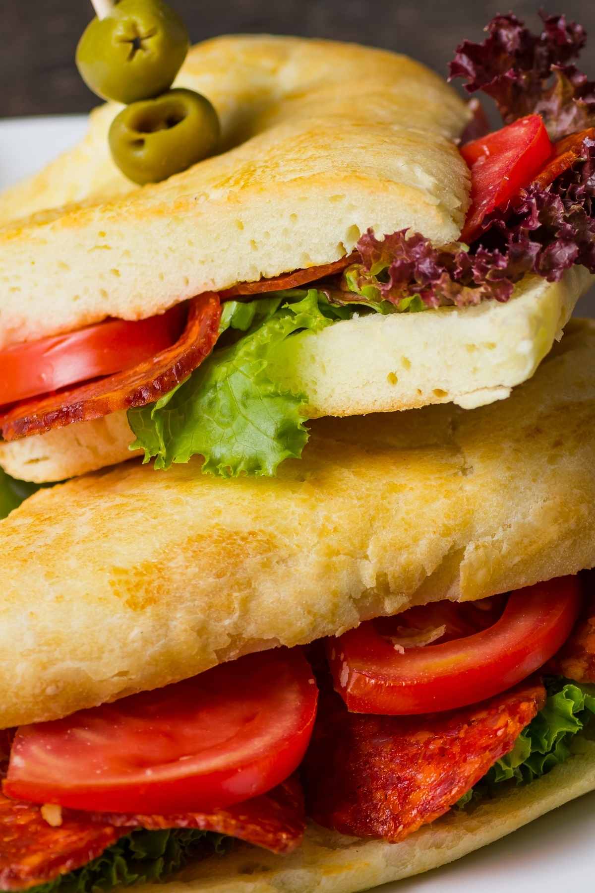 If you’re craving a meal that’s hearty and big on flavor, this Italian pepperoni sandwich is just what you need. It’s loaded with slices of pepperoni, salami, ham, and mozzarella cheese.