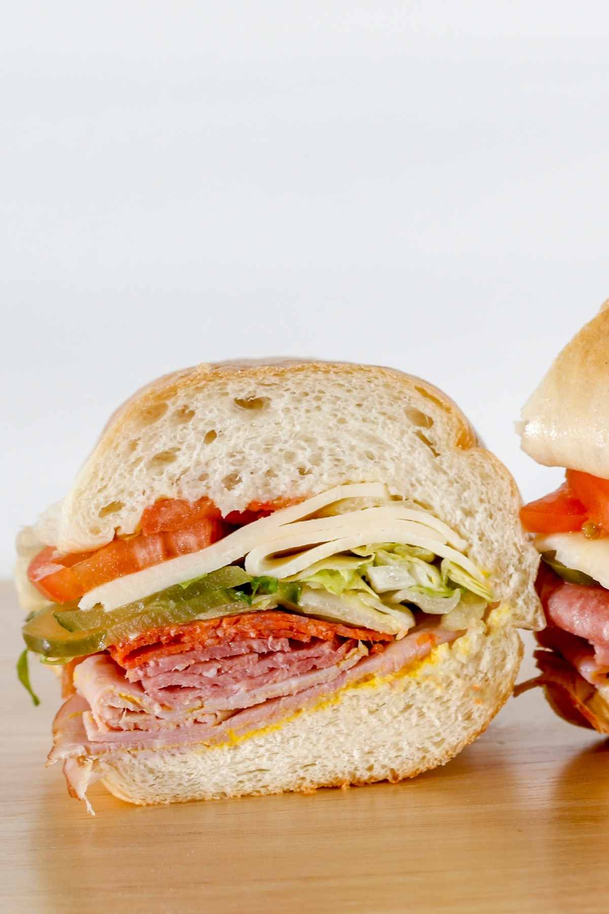 If you’re craving a meal that’s hearty and big on flavor, this Italian pepperoni sandwich is just what you need. It’s loaded with slices of pepperoni, salami, ham, and mozzarella cheese.