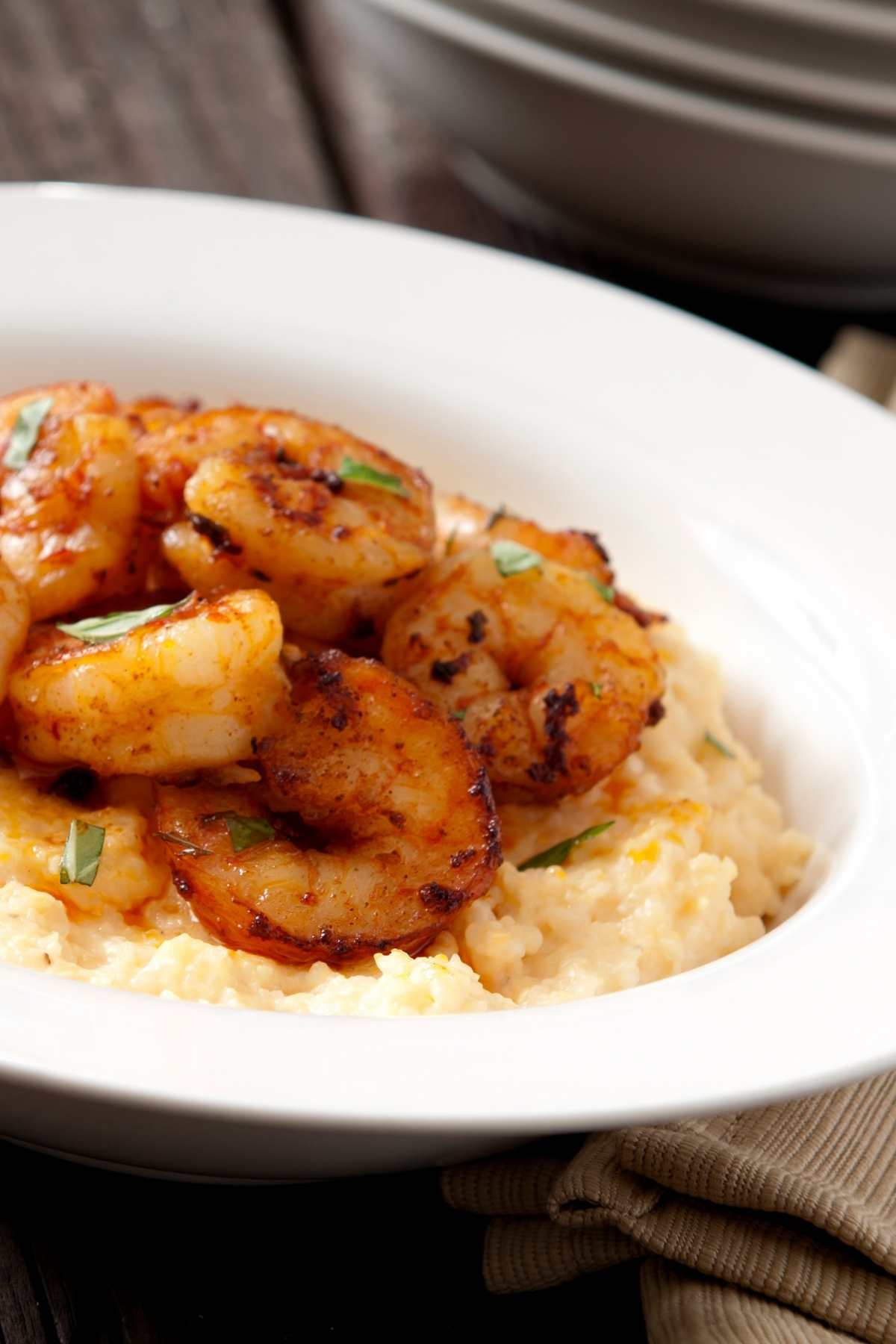 This iconic Southern recipe combines delectable shrimp in a spicy sauce with creamy cheese grits for the ultimate comfort food meal! It’s a quick dinner for busy people, an easy way to satisfy seafood lovers, and it’s gluten-free!