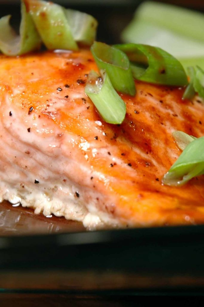 Baked Steelhead Trout filet is juicy and flavorful yet couldn’t be easier to make! Top it with shallots, garlic, lemon, and fresh herbs for an impressive meal. This versatile recipe also works well with salmon.