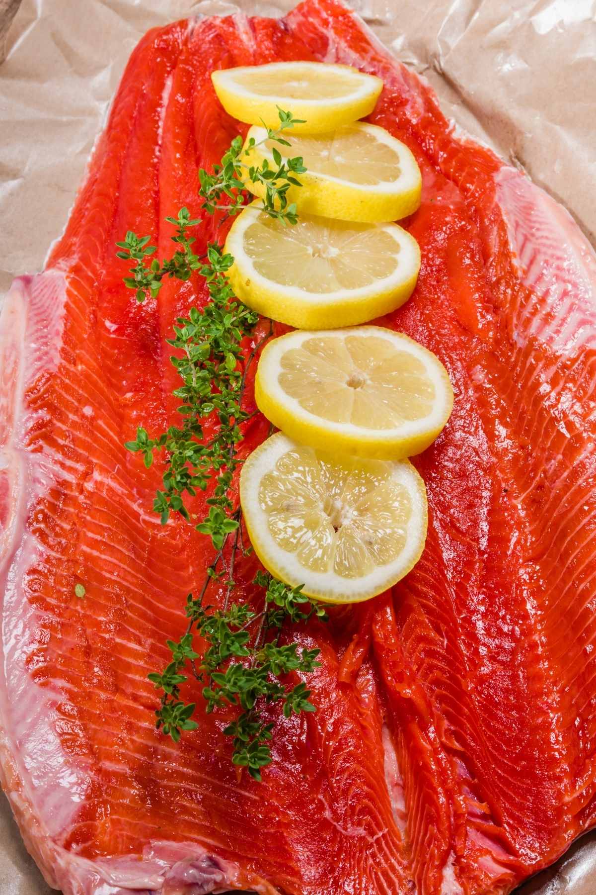 Baked Steelhead Trout filet is juicy and flavorful yet couldn’t be easier to make! Top it with shallots, garlic, lemon, and fresh herbs for an impressive meal. This versatile recipe also works well with salmon.