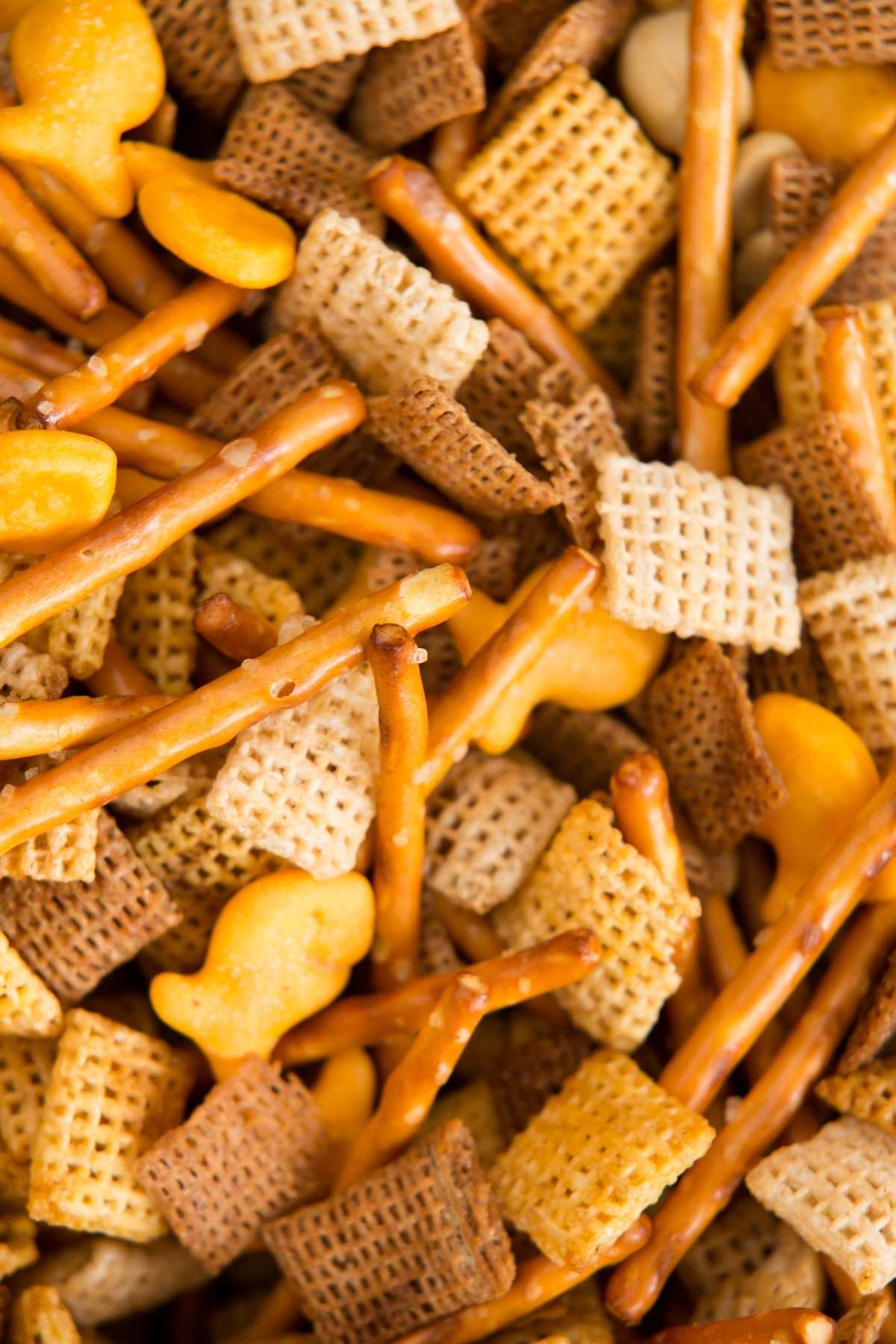With this quick and simple recipe, you can make your own tasty Chex Mix snack to enjoy when friends and family come over. Made with Chex cereal, cheese crackers, pretzels, nuts, and a delicious sauce, this savory mix is salty, crunchy, and baked to perfection. Just be careful; it's also highly addictive!