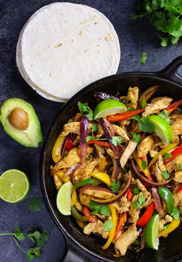 A tasty Mexican dish, chicken with peppers and onions, is a quick and easy recipe that is loaded with flavor. This juicy chicken with seasoned vegetables makes for the perfect fajitas. Just load warm tortillas with this filling and top with guacamole and a fresh drop of lime!