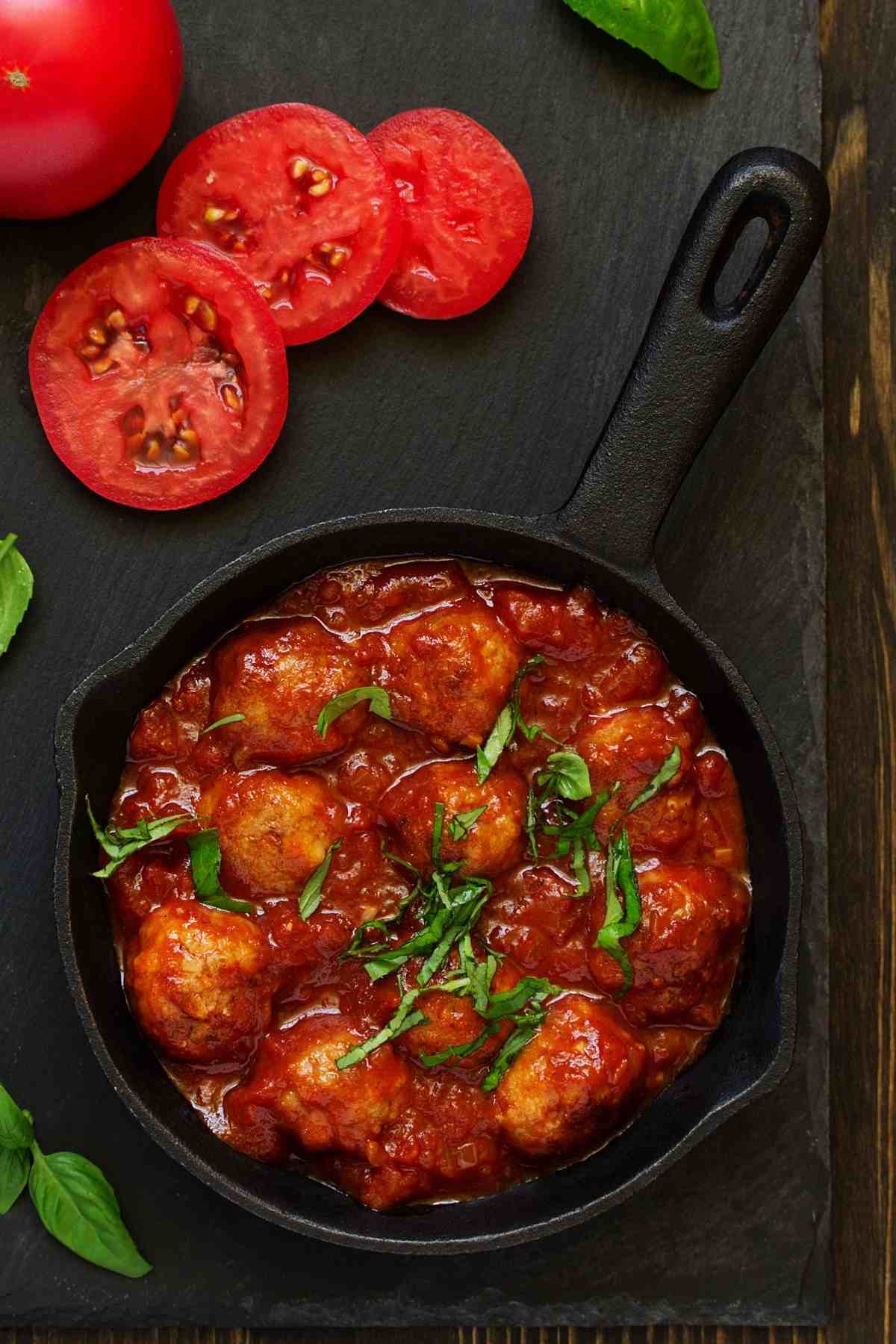This homemade Beef Meatballs Recipe is ideal when served over pasta or in sandwiches! The meatballs are tender and juicy, and the tomato sauce is tangy and flavorful.