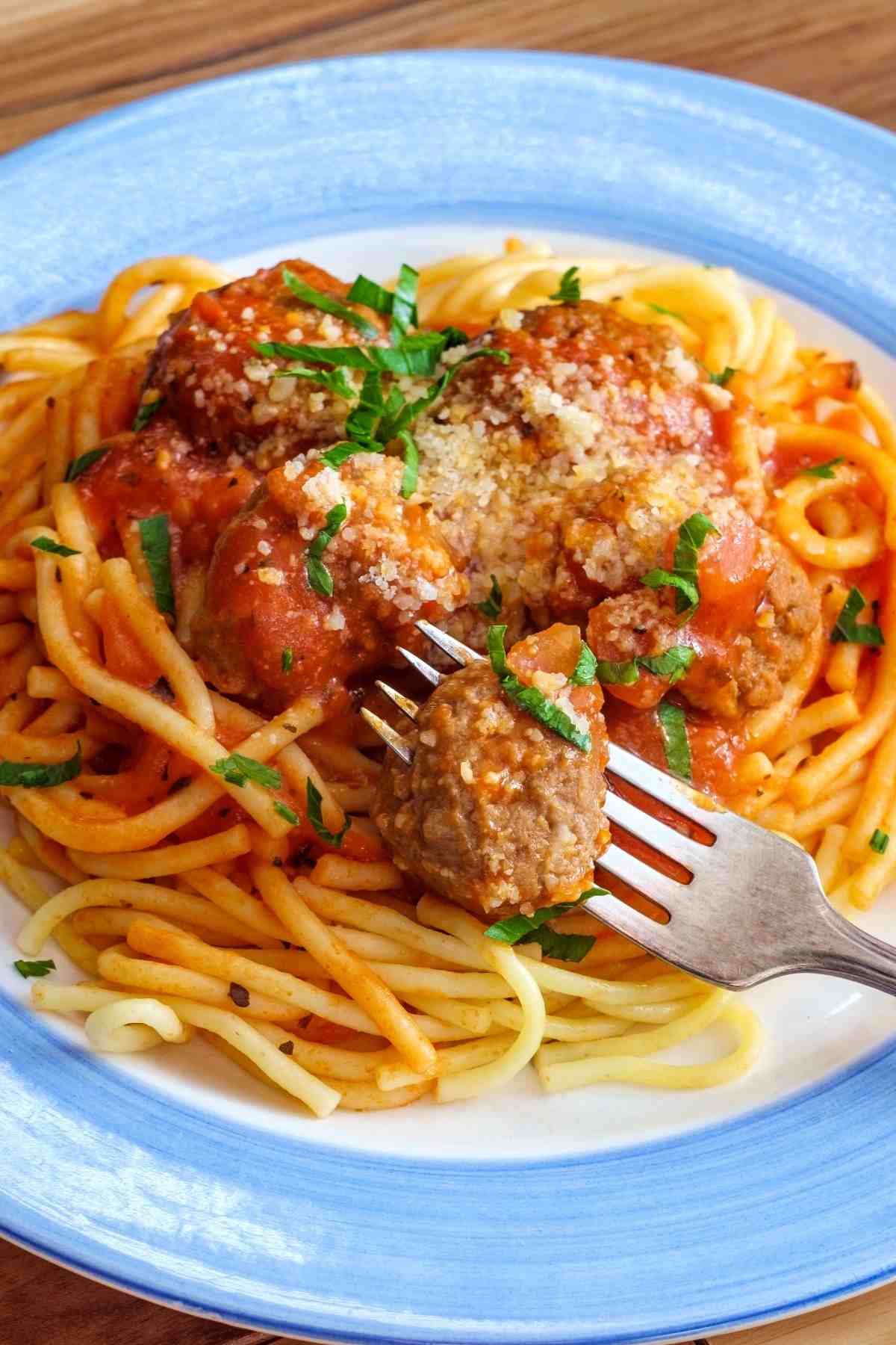 This homemade Beef Meatballs Recipe is ideal when served over pasta or in sandwiches! The meatballs are tender and juicy, and the tomato sauce is tangy and flavorful.