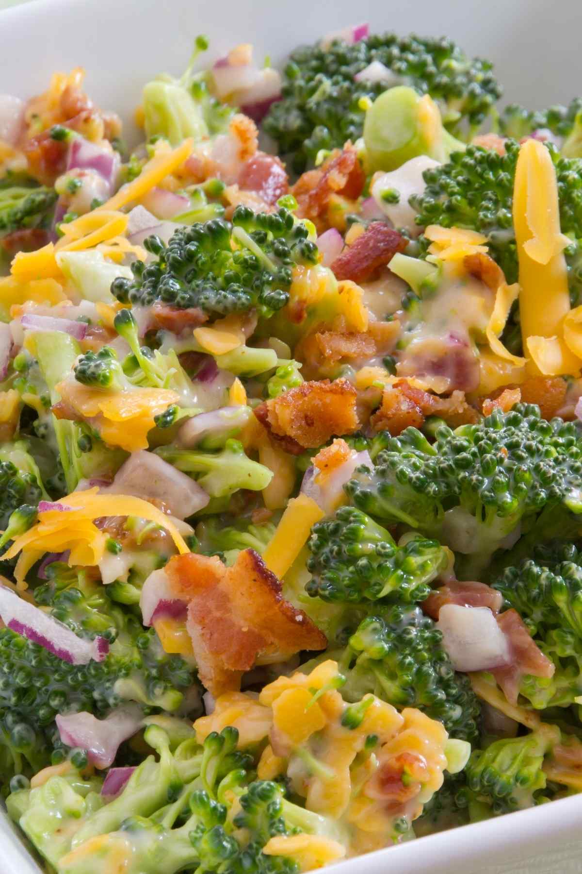 Switch up your salad game with this crunchy Broccoli Salad With Bacon. The raw broccoli florets pair beautifully with tart dried cranberries, sharp cheddar cheese, salty sunflower seeds, and smokey bacon tossed in a creamy dressing.