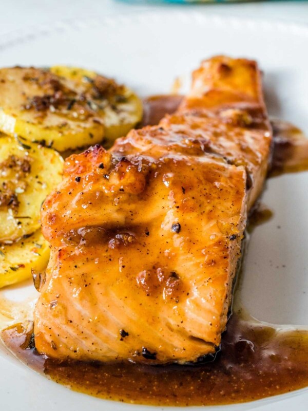 You might be surprised to discover the delicious flavor of this Peanut Butter Glazed Salmon. The salmon is perfectly cooked, and the glaze is a tasty combination of peanut butter, chili garlic sauce, and orange juice.