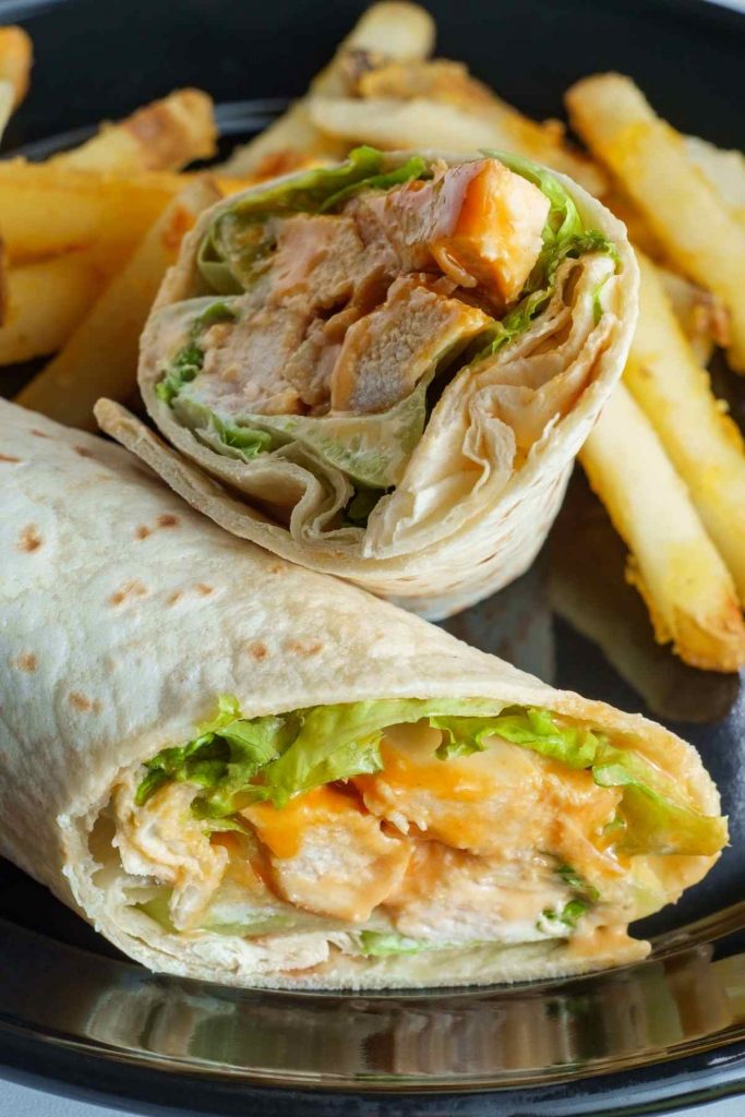 This copycat of McDonald’s grilled chicken snack wrap is perfect for a satisfying lunch. The chicken is seasoned with paprika, garlic powder, oregano, and cumin, and the wrap is drizzled with store-bought ranch dressing to save time.