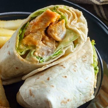 This copycat of McDonald’s grilled chicken snack wrap is perfect for a satisfying lunch. The chicken is seasoned with paprika, garlic powder, oregano, and cumin, and the wrap is drizzled with store-bought ranch dressing to save time.
