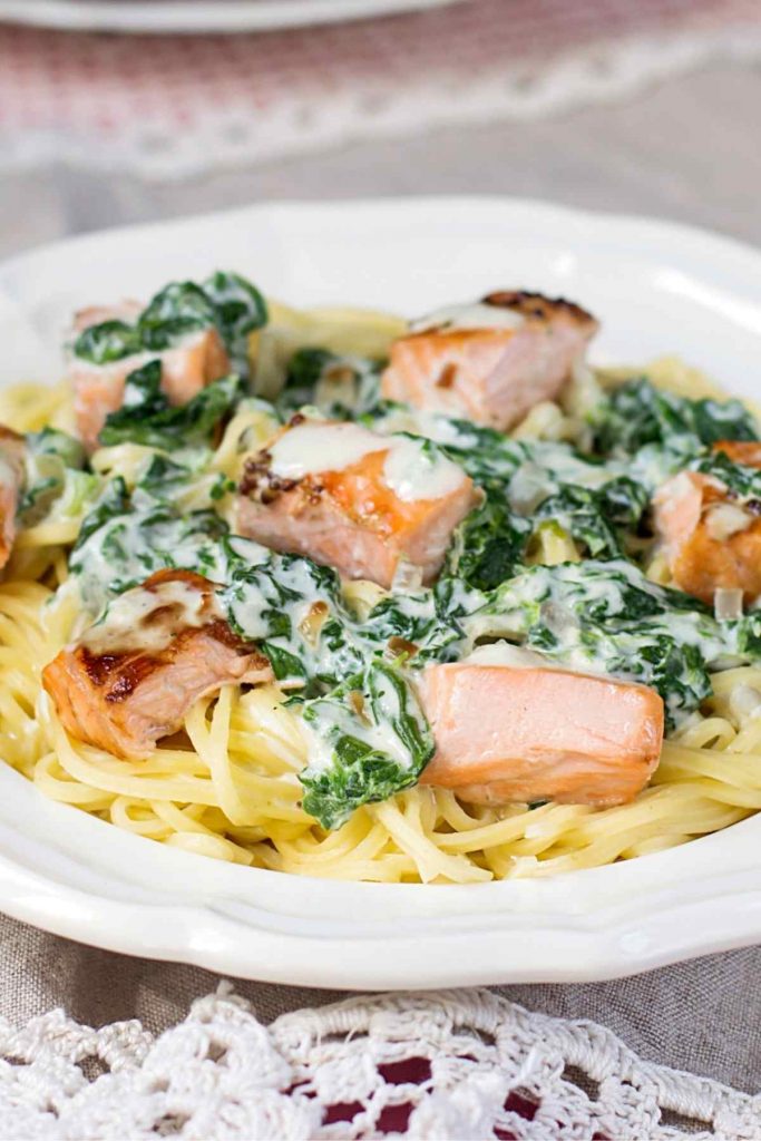 This Creamy Salmon Pasta is a delicious one-dish meal that’s easy enough to serve during the week. It features an irresistible sauce that’s made with heavy cream, white wine, butter, garlic, and lemon zest.