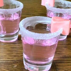 These Pink Starburst Shots are a fun drink to serve at a party. They’re made with vanilla vodka, sweet and sour mix, and watermelon pucker schnapps.