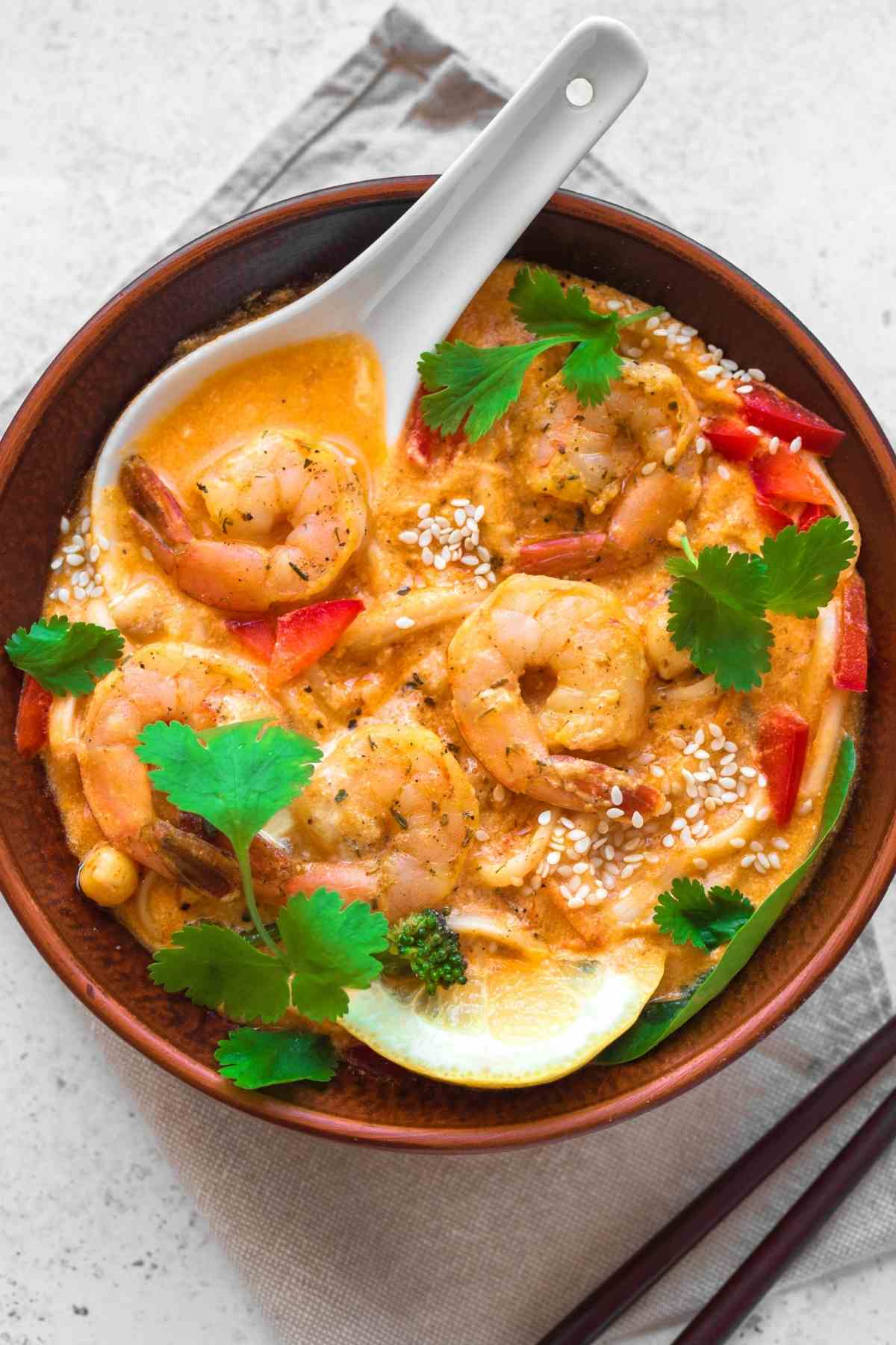 You have never had a homecooked dish of Thai Coconut Shrimp Curry this good! With a coconut curry sauce and succulent shrimp, this recipe is so delicious and beyond easy to make.