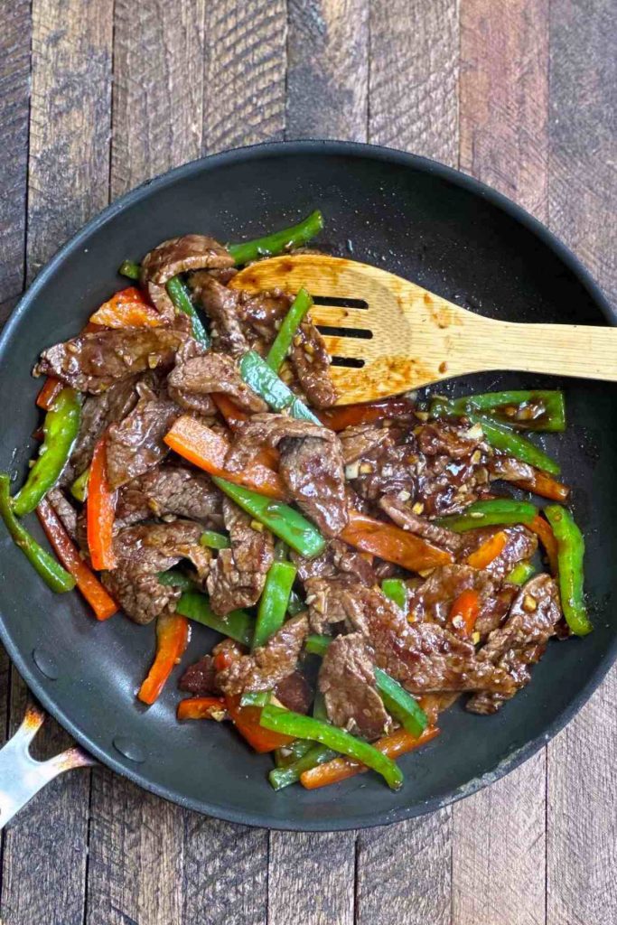 This Pepper Steak And Rice is restaurant quality! The steak is perfectly cooked until tender along with bell peppers, garlic, ginger, soy sauce, and a touch of sugar for sweetness.
